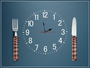Lunch time concept, Clock in plate, knife and fork
