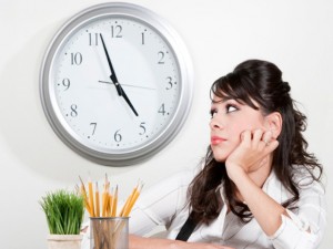 bored-woman-waiting-for-end-of-work-day